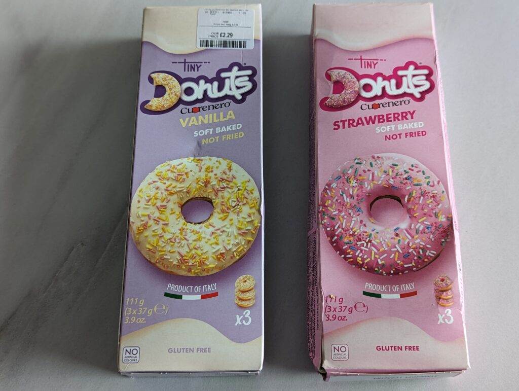 A picture of two boxes of gluten-free doughnuts from TK Maxx - Vanilla and Strawberry flavours.